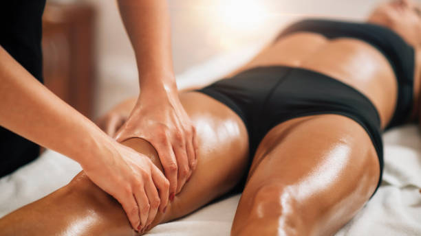 Anti cellulite female thigh massage at a beauty spa salon. Body care concept.